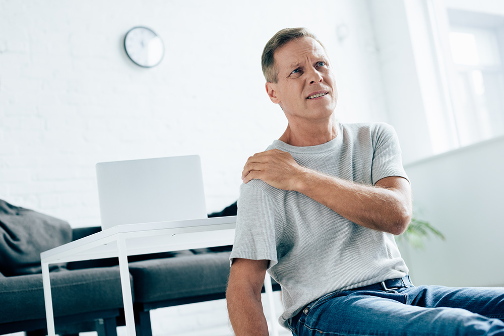 5 things I wish I knew before shoulder surgery handsome man in t shirt feeling pain in shoulder i 2022 12 16 16 54 52 utc 5 things I wish I knew before shoulder surgery