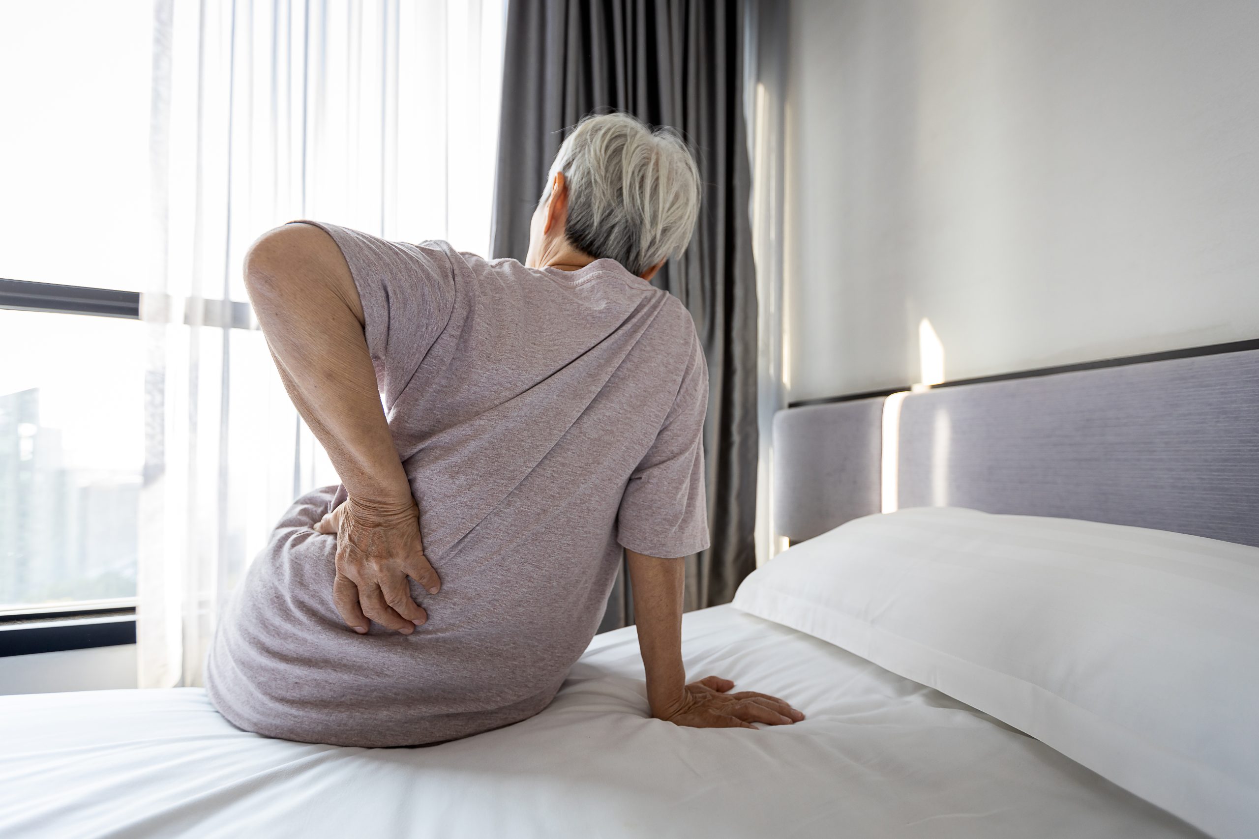 How to Relieve Hip Pain From Sleeping On Your Side AdobeStock 403583141 scaled How to Relieve Hip Pain From Sleeping On Your Side